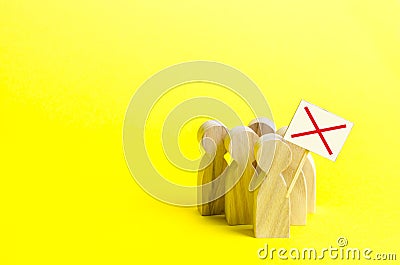 A group of protesting figures with signs on an yellow background. An angry mob of wooden figures of people with a poster. Stock Photo