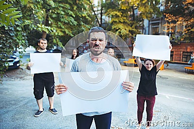 Group of protesting young people outdoors Stock Photo