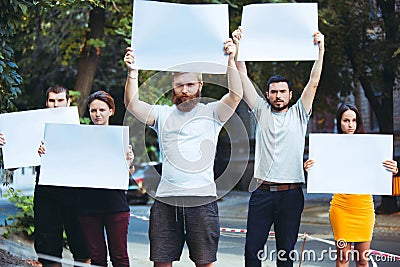 Group of protesting young people outdoors Stock Photo