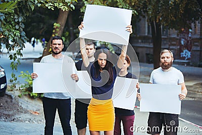 Group of protesting young people outdoors Stock Photo