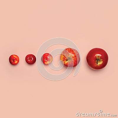 Group red apples fruits isolated on pink background, creative fashion minimalism Stock Photo