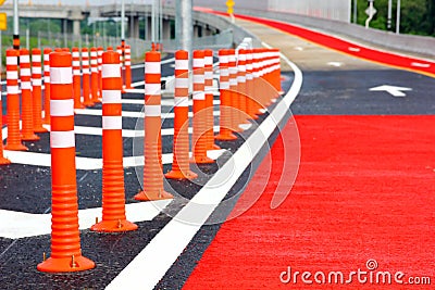 Group of red traffic cones installed on new road warning sign for safety drive Stock Photo