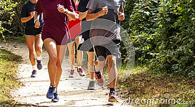 Group of runners on a dirt trail running Stock Photo