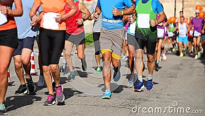 group of runners during the race in the city Stock Photo