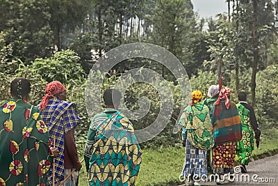 Group of rural Rwandan women in colorful traditionals clothes walking along the road, Kigali, Rwanda Editorial Stock Photo