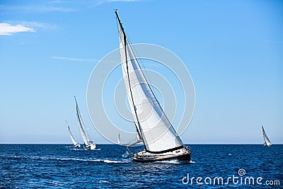 Group of sail yachts in regatta in open the Sea. Boat in sailing regatta. Stock Photo