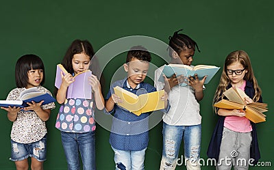 Group of school kids reading for education Stock Photo