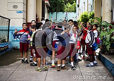 Group with schoolchildren standing in front of their school Editorial Stock Photo