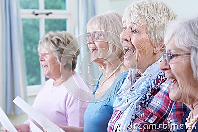 Group Of Senior Women Singing In Choir Together Stock Photo
