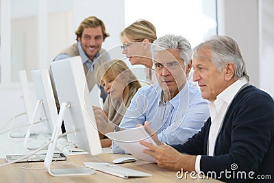 Group of seniors in business training course Stock Photo
