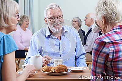 Group Of Seniors Meeting At Social Club Stock Photo