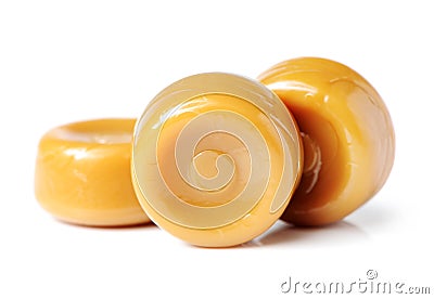 Group of seven whole hard caramel cream candy butterscotch variety Stock Photo