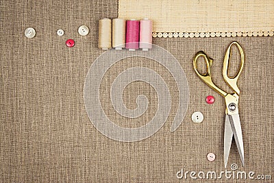 Group of sewing objects lying flat on a natural linen Stock Photo