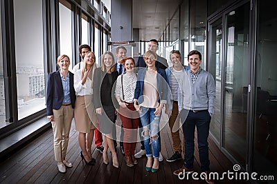 Group shot of business people in modern office hall Stock Photo