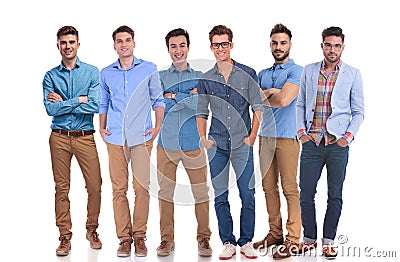 Group of six young casual men standing confidently Stock Photo