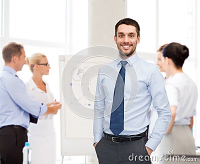 Group of smiling businessmen with smartboard Stock Photo