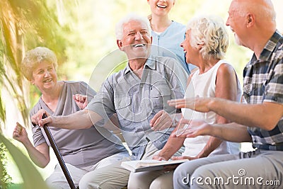 Group of smiling senior friends Stock Photo