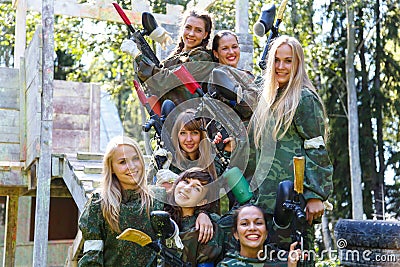 Group of smiling young girls with paintball ammunition Stock Photo