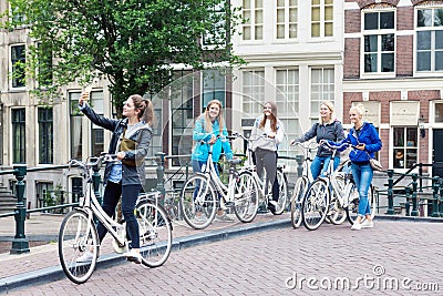 Group of smiling young girls taking selfie photo on the street i Editorial Stock Photo