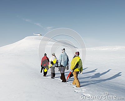 Group of snowboarders enjoying a beautiful Winter morning Concep Stock Photo