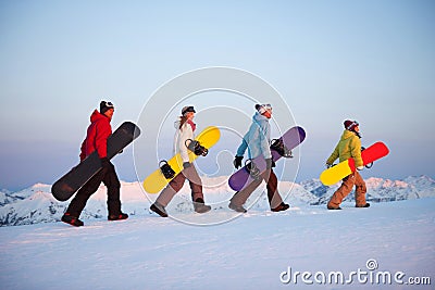 Group of snowboarders on top of the mountain Stock Photo