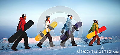 Group of snowboarders on top of the mountain. Stock Photo