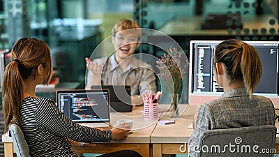 Group of software developers brainstorming and discussion for developing software applications at modern office Stock Photo