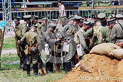 A group of soldiers-reenactors. Editorial Stock Photo