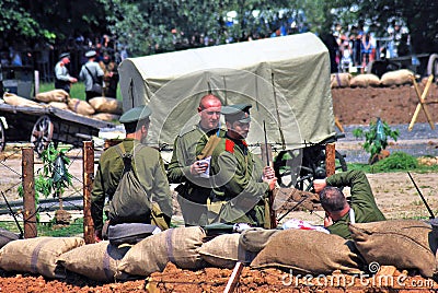 Group of soldiers-reenactors. Outroods portait. Editorial Stock Photo