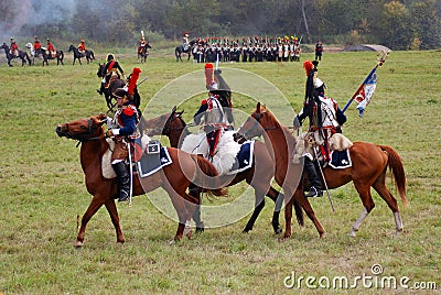 Group of soldiers-reenactors ride horses. Editorial Stock Photo