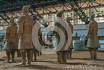 Group of soldiers seen from back at Terracotta Army excavation hall, Xian, China Editorial Stock Photo
