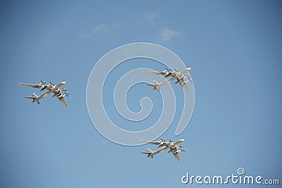 The group of Soviet strategic bomber Tupolev Tu-95 `Bear` flies over Red Square. Dress rehearsal of the Victory Day parade on Red Editorial Stock Photo