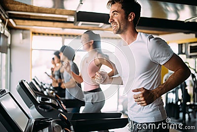 Group of sportive people in a gym. Concepts about lifestyle and sport in a fitness club Stock Photo