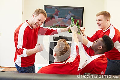 Group Of Sports Fans Watching Game On TV At Home Editorial Stock Photo