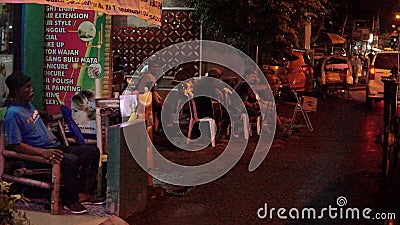 A group of street singers is singing on the side of the road Editorial Stock Photo