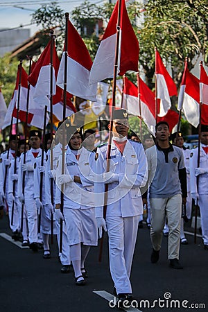 Group of students marching with Indonesian flag on National Independence Day in Yogyakarta, 17 August 2021 Editorial Stock Photo