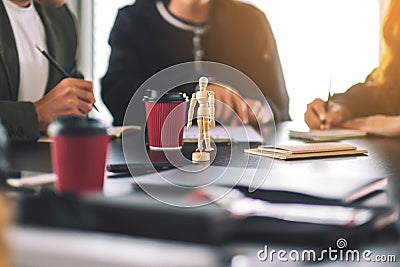 Students studying art with figure model on the table Stock Photo