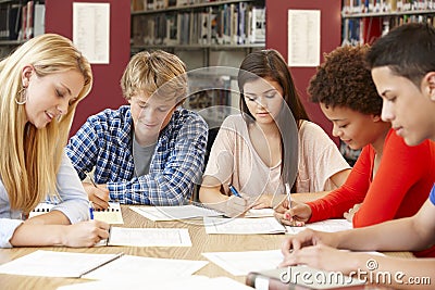Group of students working together in library Stock Photo