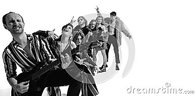 Group of stylish expressive people, man and woman, rock music performers posing over white background. Generation of 50s Stock Photo