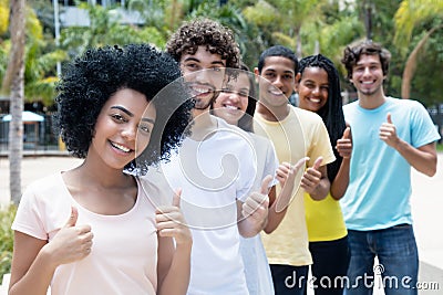 Group of successful multi ethnic young adults in line Stock Photo