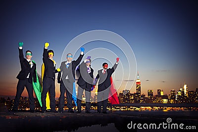 Group of Superhero Businessmen Arms Raised Stock Photo