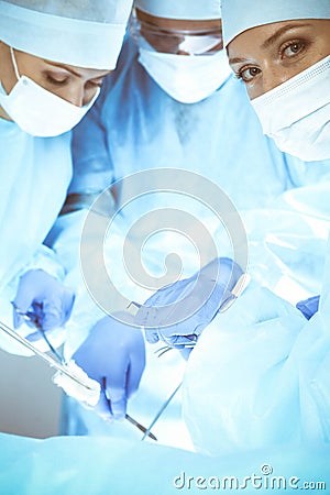 A group of surgeons is operating at the hospital. Health care concept Stock Photo