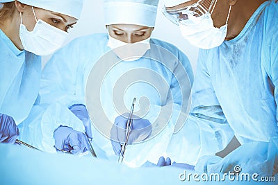 A group of surgeons is operating at the hospital. Health care concept Stock Photo