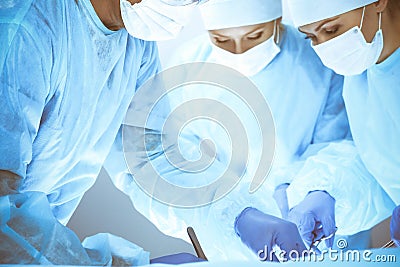 A group of surgeons is operating at the hospital. Health care concept Stock Photo