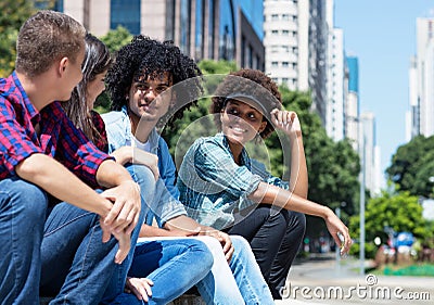 Group of talking young adults in the city Stock Photo