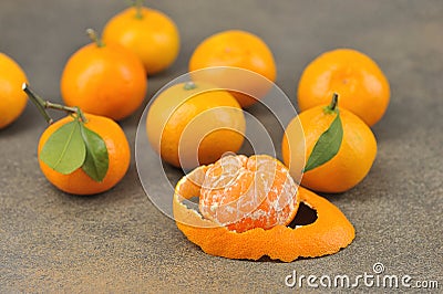 Group of tangerines-whole tangerine with leaves and peeled tangerine Stock Photo