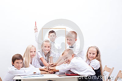 Group of teen pupils. They holding their hands Stock Photo