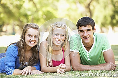 Group Of Teenage Friends Having Fun In Park Stock Photo