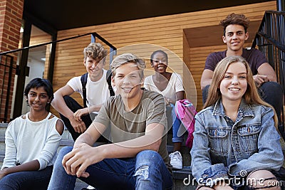 Group Of Teenage Students Socialising On College Campus Together Stock Photo