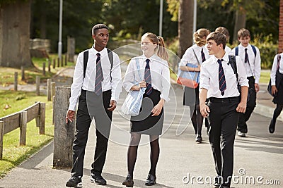 Group Of Teenage Students In Uniform Outside School Buildings Stock Photo